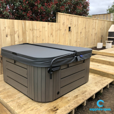 This coastal grey duratek cabinet is highlighted by the rich cypress timber backdrop thanks to the team @ Paramount Pools & Spas Tauranga NZ