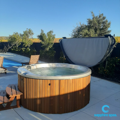 myHotTub sits warmly beside this inground swimming pool for Mum & Dad to watch the kids : installed by the team @ Wright Pools & Spas NZ